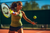 A woman playing tennis. She's having muscle pain due to hypothyroidism.